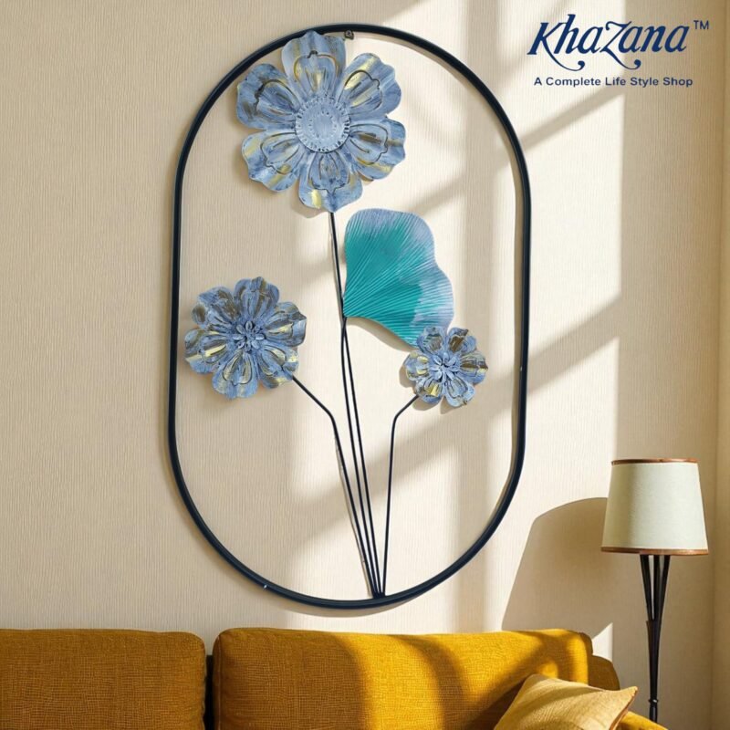 artistic grey and gold metal flower wall decor with teal leaf