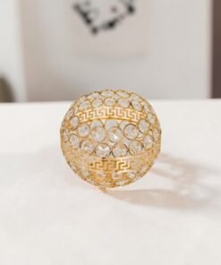 elegant gold crystal candle holder trio with greek key detailing