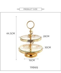 This luxurious 2-tier serving stand is a masterpiece of functional decor, designed to bring a regal touch to any table setting. With its intricate gold-plated metalwork and clear glass surfaces, it offers a sophisticated way to display pastries, appetizers, or jewelry.
