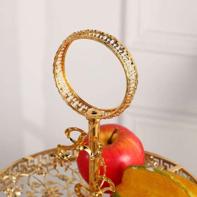 This luxurious 2-tier serving stand is a masterpiece of functional decor, designed to bring a regal touch to any table setting. With its intricate gold-plated metalwork and clear glass surfaces, it offers a sophisticated way to display pastries, appetizers, or jewelry.