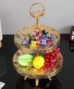 This luxurious 2-tier serving stand is a masterpiece of functional decor, designed to bring a regal touch to any table setting. With its intricate gold-plated metalwork and clear glass surfaces, it offers a sophisticated way to display pastries, appetizers, or jewelry.