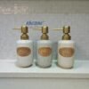 elegant speckled ceramic soap dispenser with gold pump