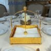 gold finish textured napkin holder with weighted arm