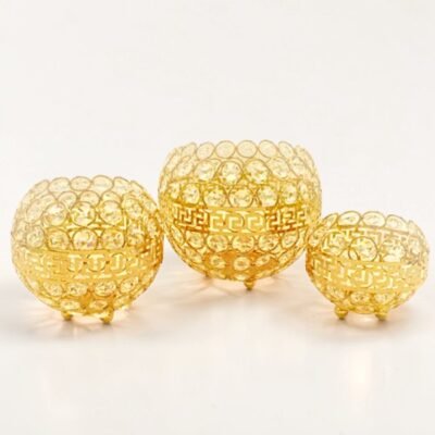 elegant gold crystal candle holder trio with greek key detailing