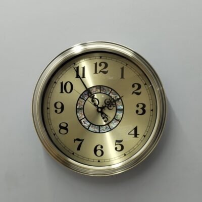 gold metal wall clock with decorative mosaic inlay