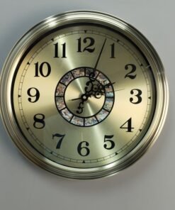 gold metal wall clock with decorative mosaic inlay