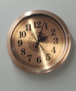 gold metal wall clock with decorative mosaic inlay