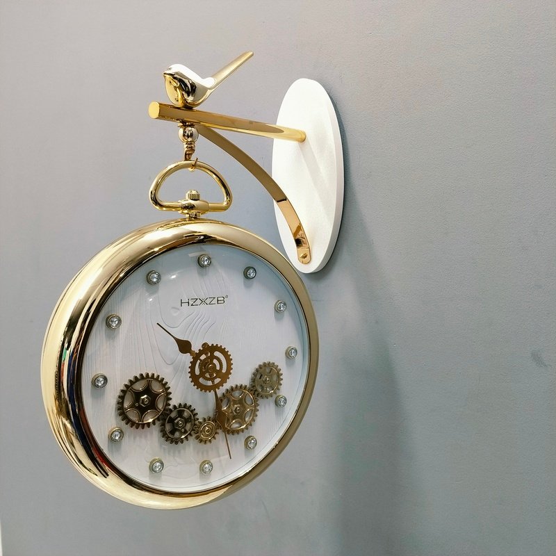 luxury vintage gold hanging station wall clock with white dial and bird motif luxury vintage gold hanging station wall clock with white dial and bird motif
