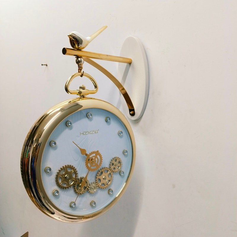 luxury vintage gold hanging station wall clock with white dial and bird motif luxury vintage gold hanging station wall clock with white dial and bird motif