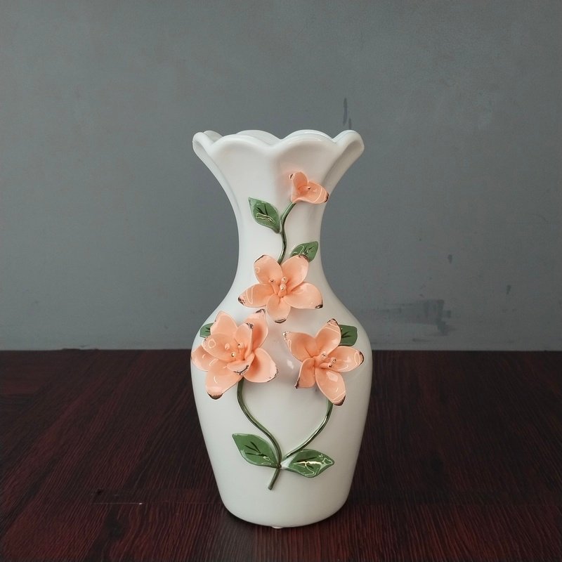 elegant white ceramic flower vase with 3d peach floral embossment elegant white ceramic flower vase with 3d peach floral embossment