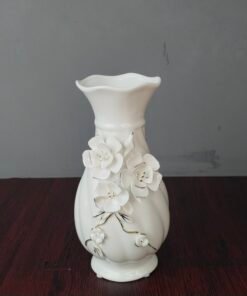 elegant white ceramic flower vase with 3d floral relief elegant white ceramic flower vase with 3d floral relief
