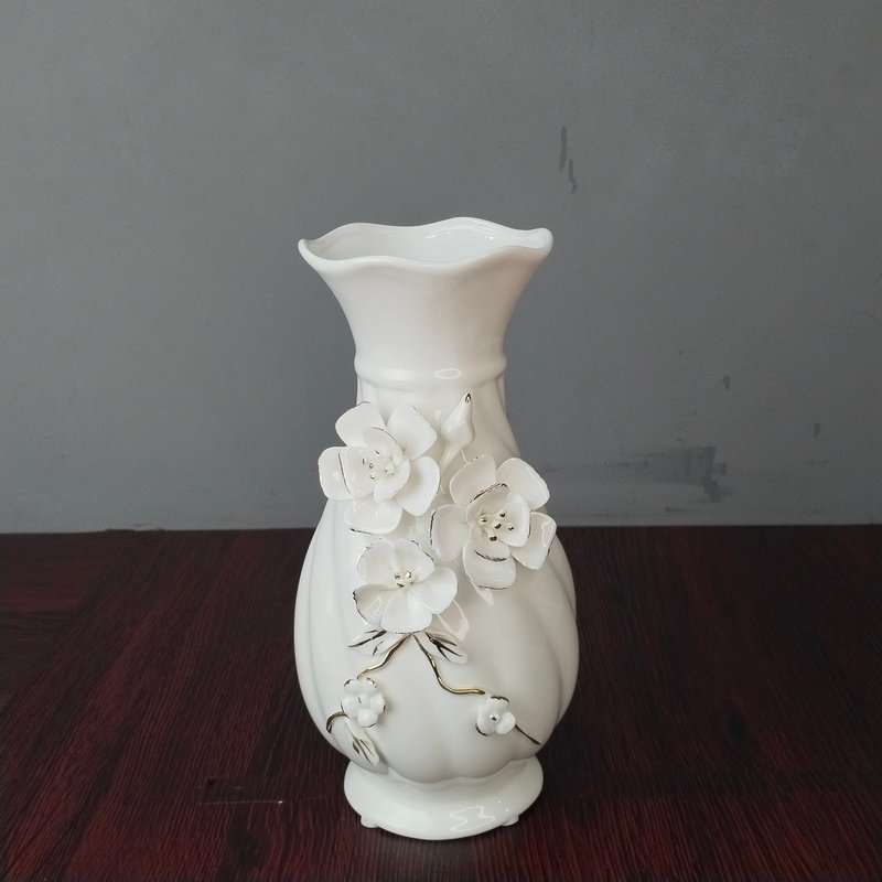 elegant white ceramic flower vase with 3d floral relief elegant white ceramic flower vase with 3d floral relief
