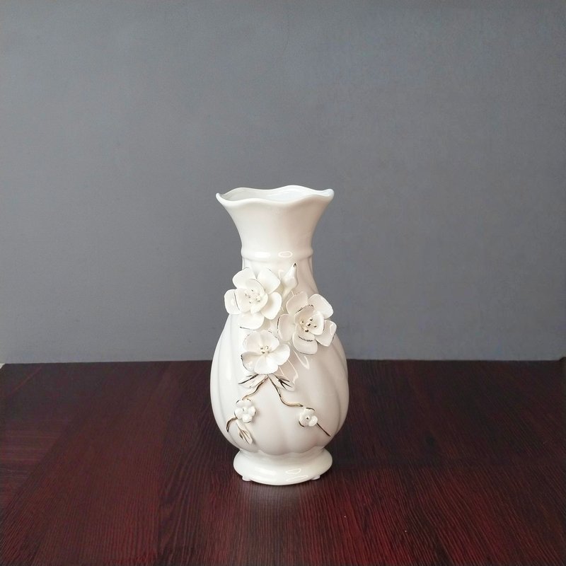 elegant white ceramic flower vase with 3d floral relief elegant white ceramic flower vase with 3d floral relief