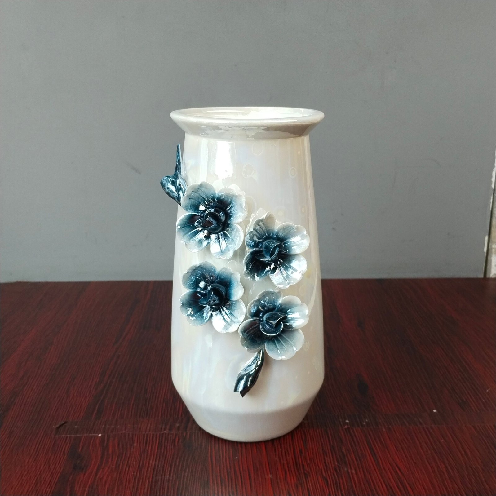 Ceramic Flower Vase with 3D Blue Floral Accents Ceramic Flower Vase with 3D Blue Floral Accents
